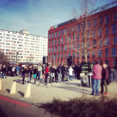 a group of people standing around in a city at Cozy apartment fully equipped in Prague