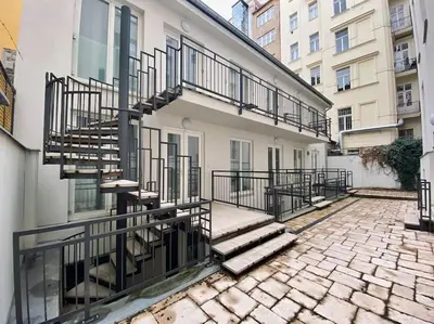 a building with stairs on the side of it at Urban downtown studio in Prague