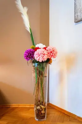 a vase filled with flowers sitting on a table at Moonlight Deluxe Suite in Prague