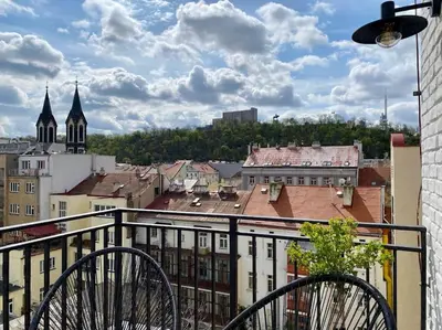a view of a city from a balcony at Romantic Terrace Studio in Karlín in Prague
