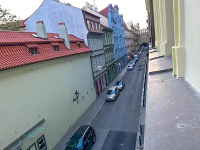 a view of a city street with cars parked on the street at Stylish Apartment Next To Wenceslas Square in Prague