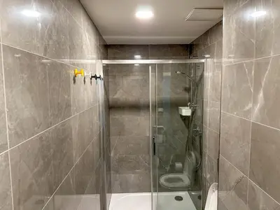 a bathroom with a shower and a toilet at Stylish Apartment Next To Wenceslas Square in Prague