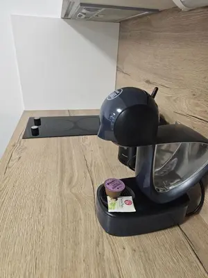 a helmet sitting on the floor next to a table at Apartment - O2 Arena Prague with parking in Prague
