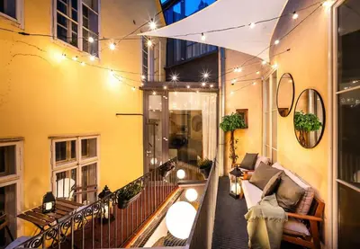a balcony of a building with lights on it at 4BR & 2,5Bath Harry Potter Old TOWN and GREAT patio in Prague