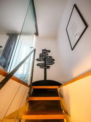 a stairway with a sign on the wall at 4BR & 2,5Bath Harry Potter Old TOWN and GREAT patio in Prague