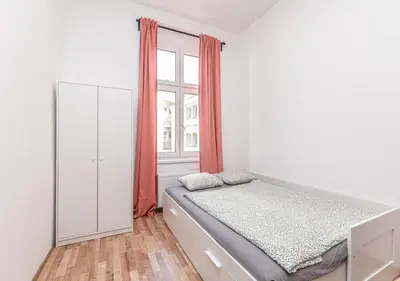 a bedroom with a bed and a window at Elegance Apartments in Prague