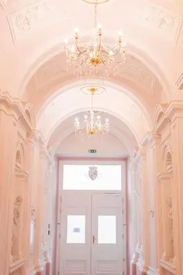 a chandelier hanging over a door in a room at Charming Apartment by Wenceslas square and National Museum with AC in Prague