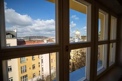 a view of a city from an open window at Charming Apartment by Wenceslas square and National Museum with AC in Prague