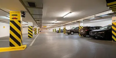 a large parking garage with cars parked in it at Charming Apartment by Wenceslas square and National Museum with AC in Prague