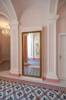 a room with a mirror on the wall and a floor at Charming Apartment by Wenceslas square and National Museum with AC in Prague