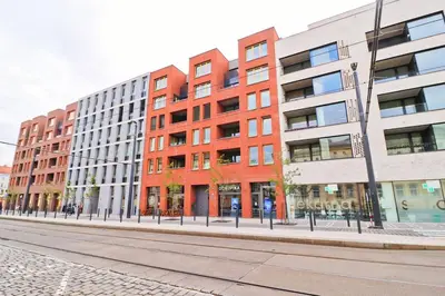 a row of tall buildings on a city street at The Peony Apartment in Smichov, Prague 5 in Prague