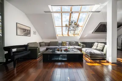a living room with a couch and a table at City View Luxury Apartments with Foosball & Xbox - In City Centre in Prague