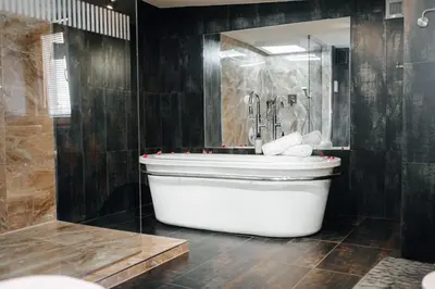 a large bathroom with a tub and a shower at City View Luxury Apartments with Foosball & Xbox - In City Centre in Prague
