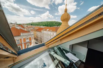 a view of the city from a window in a building at City View Luxury Apartments with Foosball & Xbox - In City Centre in Prague
