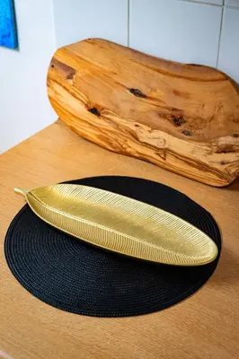 a gold comb sitting on top of a wooden table at Kingdom of Skylight in Prague