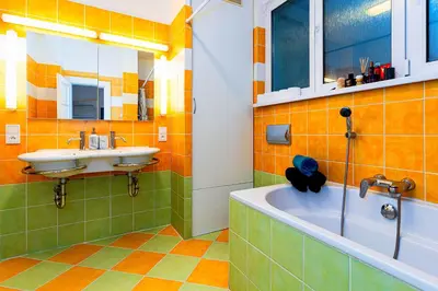 a bathroom with a tub and a sink and a tub at Kingdom of Skylight in Prague
