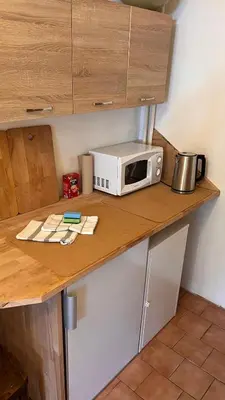 a microwave sitting on top of a kitchen counter at Prague Castle Garden Residence in Prague