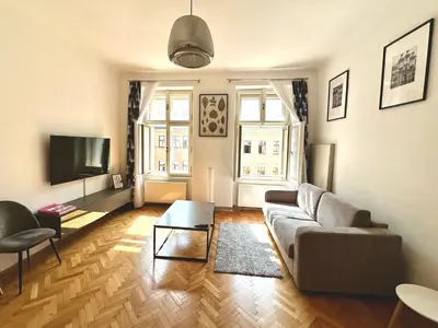 a living room with a couch and a tv at Fantastic location! SUPERHOST 5 STAR in Prague