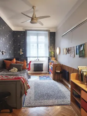 a bedroom with a bed and a desk and a window at Spacious Apartment in Central Prague 3 bedrooms, 6 people in Prague