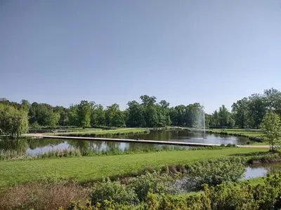 a pond with a fountain in the middle of a park at Spacious Apartment in Central Prague 3 bedrooms, 6 people in Prague