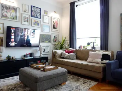 a living room with a couch and a tv at Spacious Apartment in Central Prague 3 bedrooms, 6 people in Prague