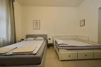 two beds in a small room at T&T Homestay in Prague