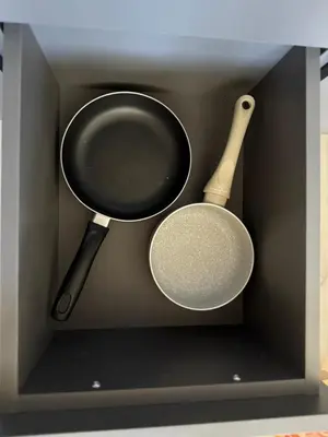 a pan and a spatula in a drawer at IOS ArtPrg in Prague