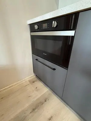 a microwave oven sitting on top of a kitchen counter at IOS ArtPrg in Prague