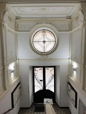 a room with a window and a clock on the ceiling at Comfortable and cosy apt a few steps from Dancing House and Naplavka Dance in Prague