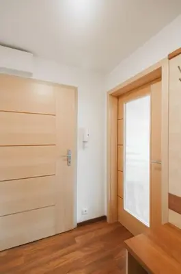an empty room with a door and a window at Dream city in Prague