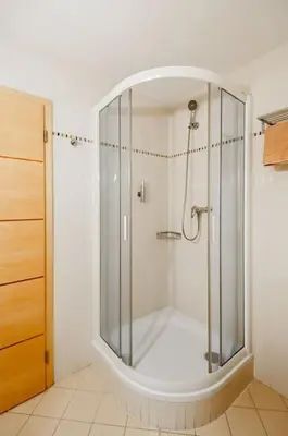 a shower with a glass enclosure in a bathroom at Dream city in Prague