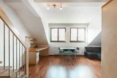 a living room with a table and a couch at Dream city in Prague