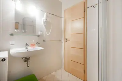 a bathroom with a sink and a shower at Dream city in Prague
