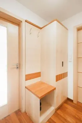 a room with a closet with white cabinets and a window at Dream city in Prague