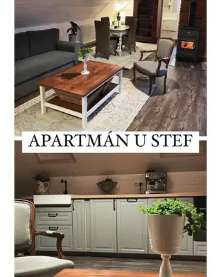 a living room with a couch and a table at Apartmán u Stef in Borotice