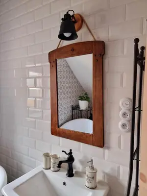 a bathroom with a mirror over a sink at Apartmán u Stef in Borotice