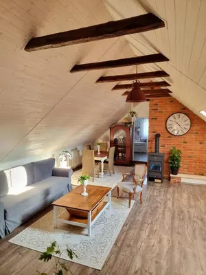 a living room with a couch and a table at Apartmán u Stef in Borotice