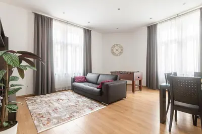 a bedroom with a large bed in a attic at Riverside Palace Apartments in Prague