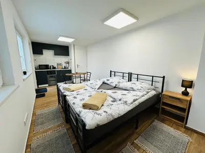 a bedroom with a bed in a room at Útulný apartmán v klidné části Benešova in Benešov