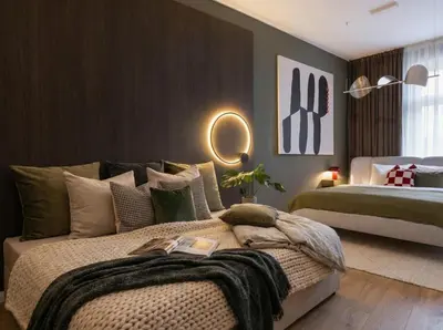 a bedroom with two beds and a mirror on the wall at TurnKey I Antonin Dvorak Apartments in Prague