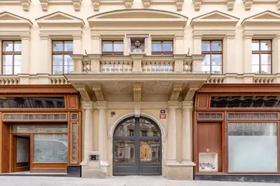 a facade of a building with a large door at TurnKey I Antonin Dvorak Apartments in Prague