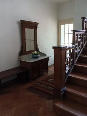 a room with a staircase and a mirror and a mirror at Apartments Bouquet in Prague