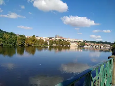 a view of a river with a bridge at Modern Apartment Všehrdova in Prague