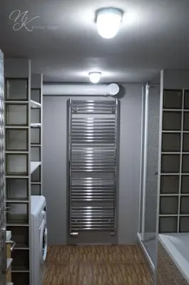 a bathroom with a shower with a sliding door at Design Apartment Havelska in Prague