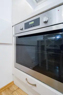 a microwave oven sitting on top of a kitchen counter at Modern Apartment Charvátova in Prague