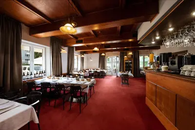 a restaurant with tables and chairs in a room at Prague Hotel Carl Inn restaurant & Free Parking in Prague