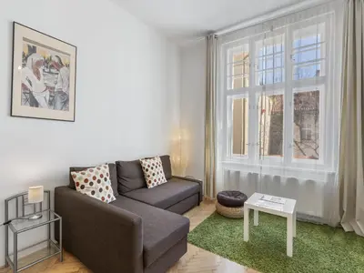 a living room with a couch and a window at Apartment Old Town home-3 by Interhome in Prague