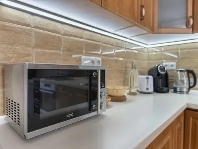 a microwave oven sitting on a counter in a kitchen at Apartment Old Town home-3 by Interhome in Prague