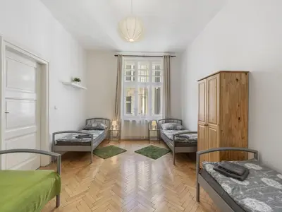 a room with three beds and a window at Apartment Old Town home-2 by Interhome in Prague