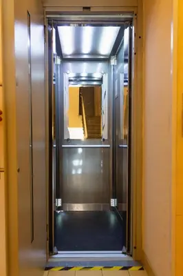 an elevator in a room with a hallway at National Museum View Studio in Prague